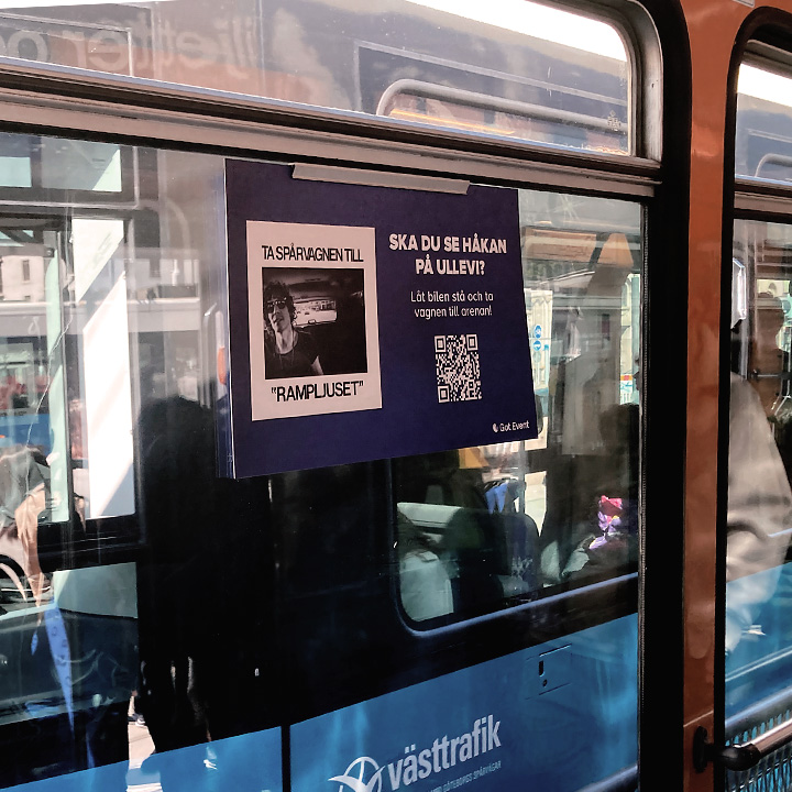 Printed advertisement hanging in tram.