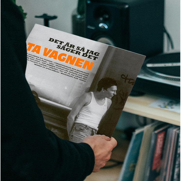 Person holding a vinyl record with Håkan Hellströms cover art.